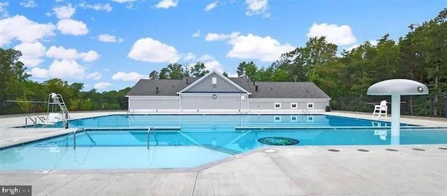 45375 Concord Way, California, MD 20619 - community pool with a patio area and view of wooded area