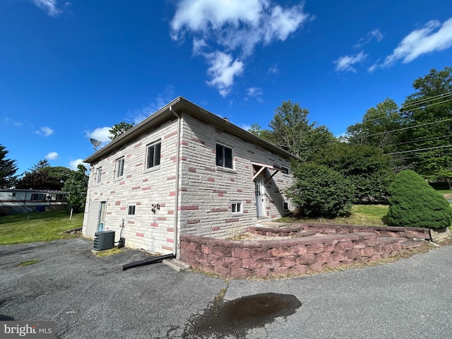 23341 Great Cove Rd, Mcconnellsburg, PA 17233 - view of home's exterior with a central air condition unit and stone siding