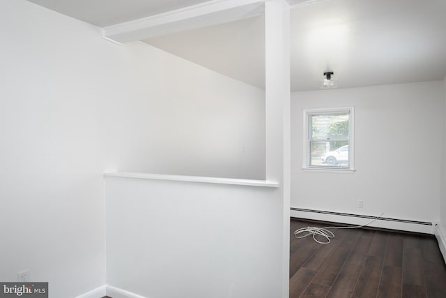 218 Elizabeth St, Bordentown, NJ 08505 - unfurnished room featuring a baseboard heating unit, wood finished floors, baseboards, and lofted ceiling