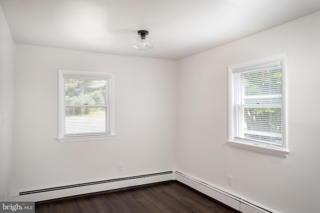 218 Elizabeth St, Bordentown, NJ 08505 - empty room with dark wood-style flooring and baseboard heating