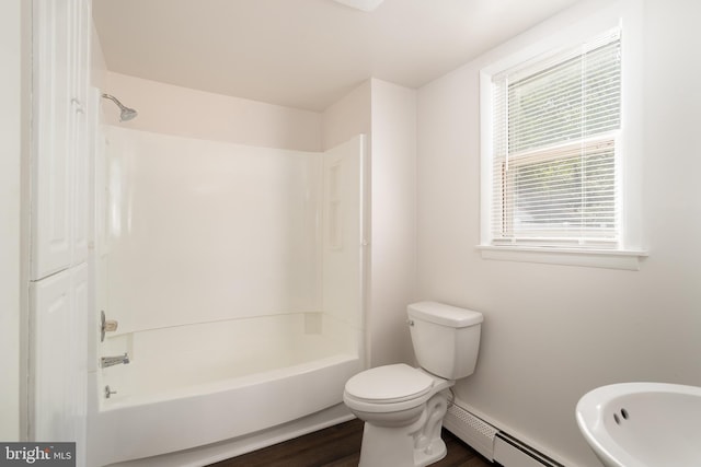 218 Elizabeth St, Bordentown, NJ 08505 - bathroom with a baseboard heating unit, bathing tub / shower combination, toilet, and wood finished floors