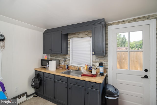 218 Elizabeth St, Bordentown, NJ 08505 - kitchen featuring a sink, light countertops, and gray cabinetry