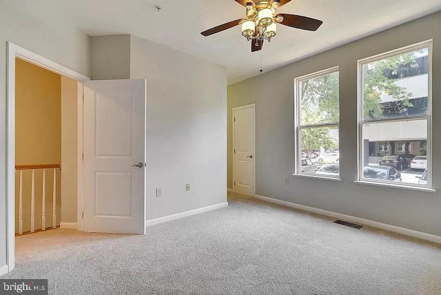 2665 Prosperity Ave Unit 6, Fairfax, VA 22031 - unfurnished bedroom featuring carpet floors, baseboards, and a ceiling fan