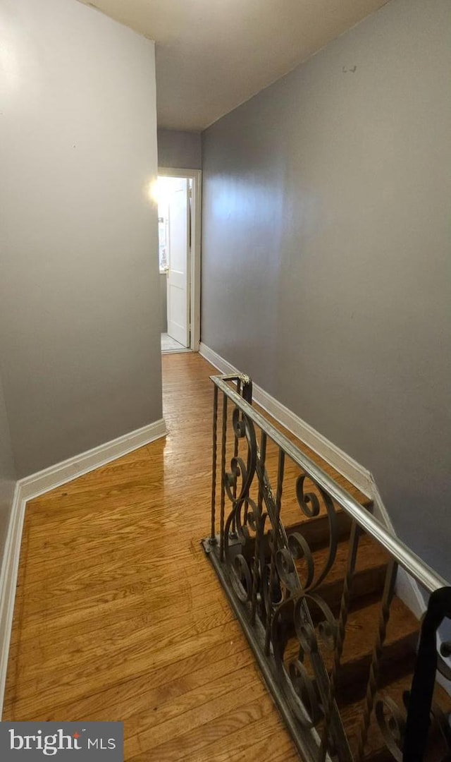6517 Montour St, Philadelphia, PA 19111 - hallway with wood finished floors, baseboards, and an upstairs landing