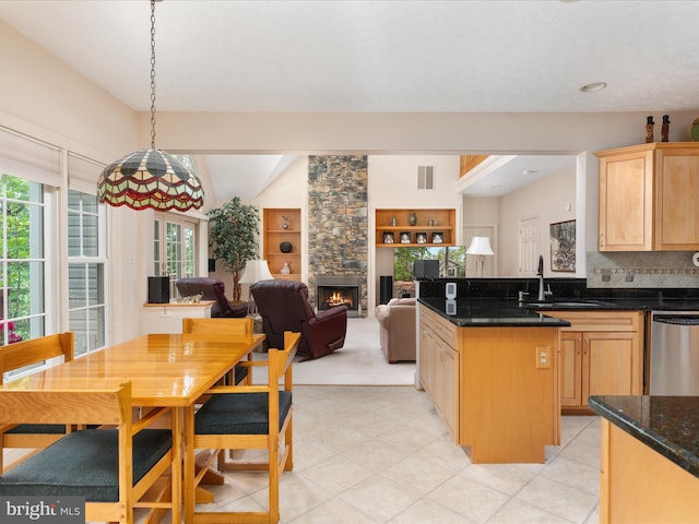 228 Sunset Cir, Cross Junction, VA 22625 - kitchen featuring a sink, dishwasher, healthy amount of natural light, a stone fireplace, and vaulted ceiling