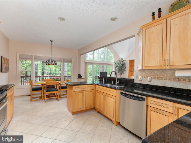 228 Sunset Cir, Cross Junction, VA 22625 - kitchen with stainless steel appliances, a sink, backsplash, light tile patterned floors, and dark stone counters