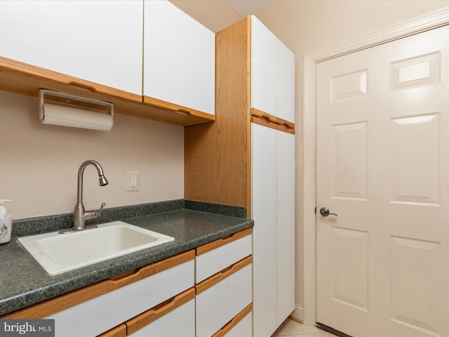 228 Sunset Cir, Cross Junction, VA 22625 - kitchen featuring a sink, white cabinetry, and dark countertops