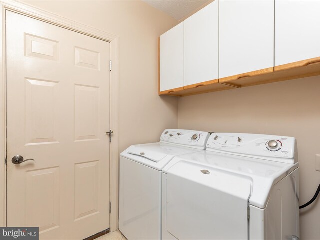 228 Sunset Cir, Cross Junction, VA 22625 - washroom featuring cabinet space and washer and dryer