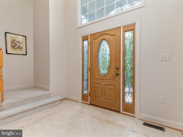228 Sunset Cir, Cross Junction, VA 22625 - entryway with baseboards, a towering ceiling, and stairs