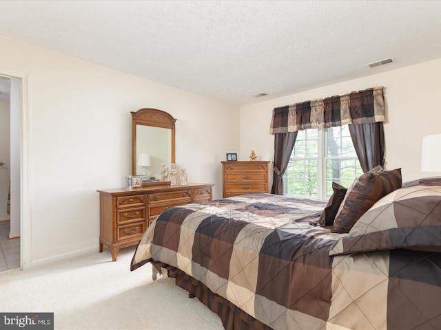 228 Sunset Cir, Cross Junction, VA 22625 - bedroom with light colored carpet, a textured ceiling, and baseboards