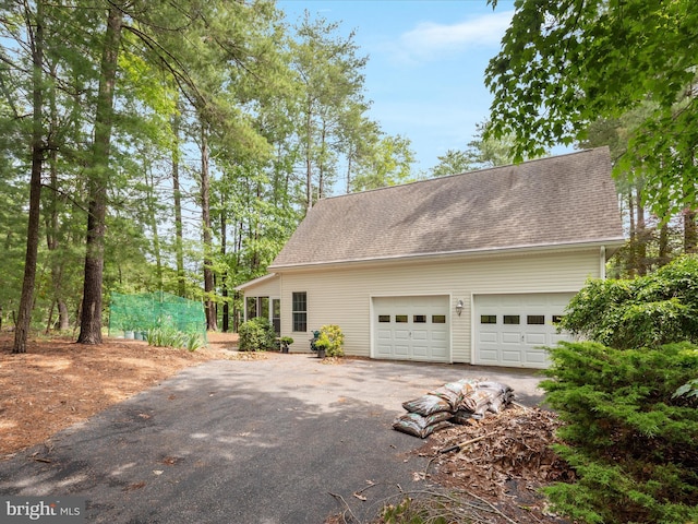 228 Sunset Cir, Cross Junction, VA 22625 - view of side of property with a shingled roof and driveway