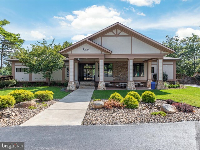 228 Sunset Cir, Cross Junction, VA 22625 - view of front of home with a porch, a front lawn, and stone siding