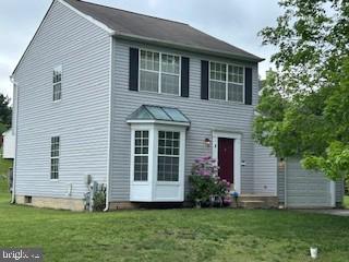 8 Cascade Range Ct, Owings Mills, MD 21117 - view of front of home with a front lawn and a garage