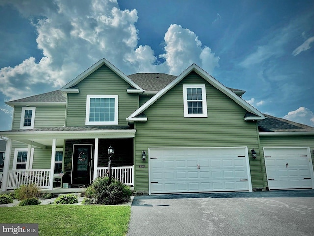 9295 Lindale Ave, Greencastle, PA 17225 - traditional-style house with driveway, covered porch, a garage, and roof with shingles
