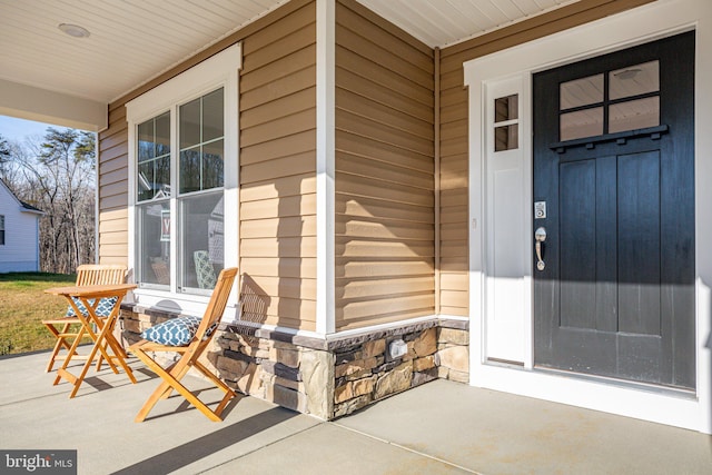7443 Long Leaf Ln, King George, VA 22485 - view of exterior entry with a porch and stone siding