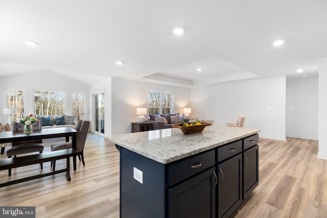 7443 Long Leaf Ln, King George, VA 22485 - kitchen featuring open floor plan, a kitchen island, light wood-style floors, light stone counters, and recessed lighting