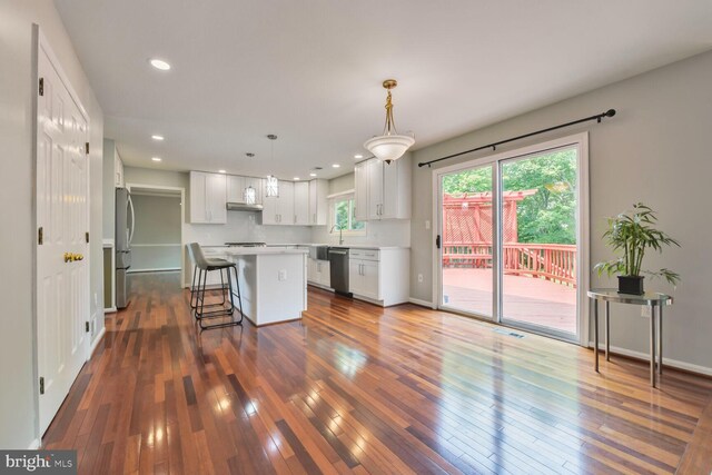 1176 Bandy Run Rd, Herndon, VA 20170 - kitchen with stainless steel appliances, a kitchen island, dark wood-style floors, white cabinetry, and recessed lighting