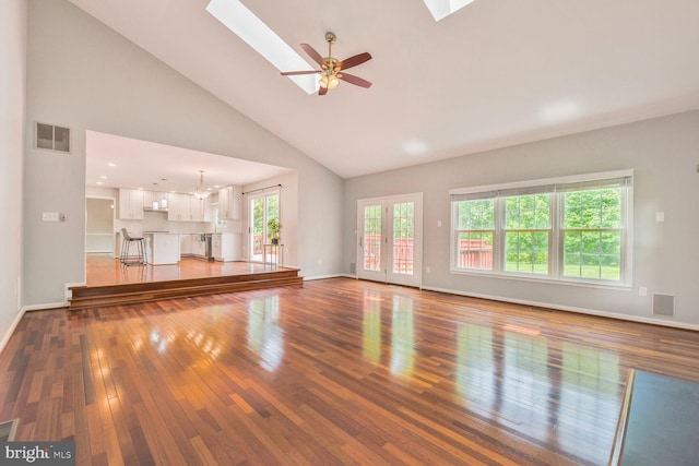 1176 Bandy Run Rd, Herndon, VA 20170 - unfurnished living room with a skylight, hardwood / wood-style flooring, high vaulted ceiling, baseboards, and ceiling fan