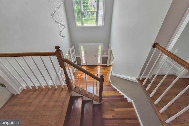 1176 Bandy Run Rd, Herndon, VA 20170 - staircase with wood finished floors, baseboards, and a high ceiling