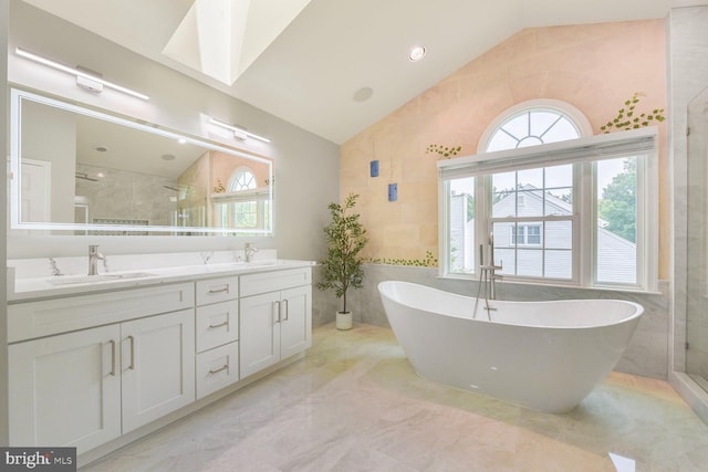 1176 Bandy Run Rd, Herndon, VA 20170 - full bathroom with vaulted ceiling, tile walls, double vanity, a soaking tub, and a stall shower