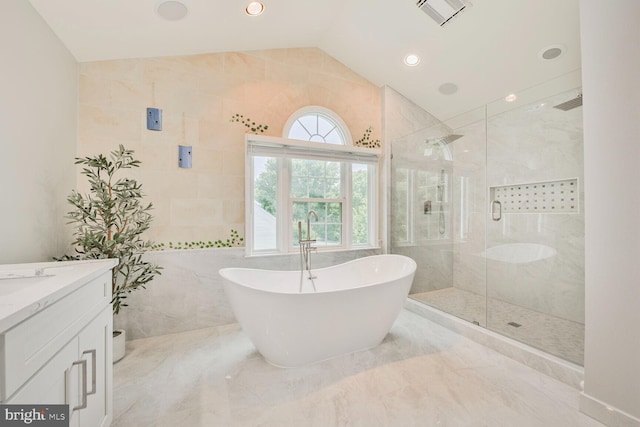 1176 Bandy Run Rd, Herndon, VA 20170 - full bath with a soaking tub, a stall shower, vanity, lofted ceiling, and tile walls