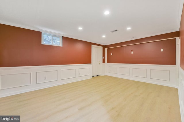 1176 Bandy Run Rd, Herndon, VA 20170 - below grade area featuring light wood finished floors, recessed lighting, a wainscoted wall, and a decorative wall