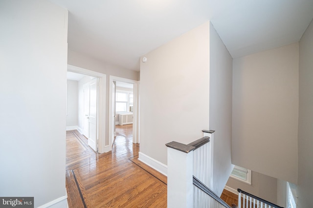 27 Shelbourne Rd, Havertown, PA 19083 - hall featuring an upstairs landing, baseboards, and wood finished floors