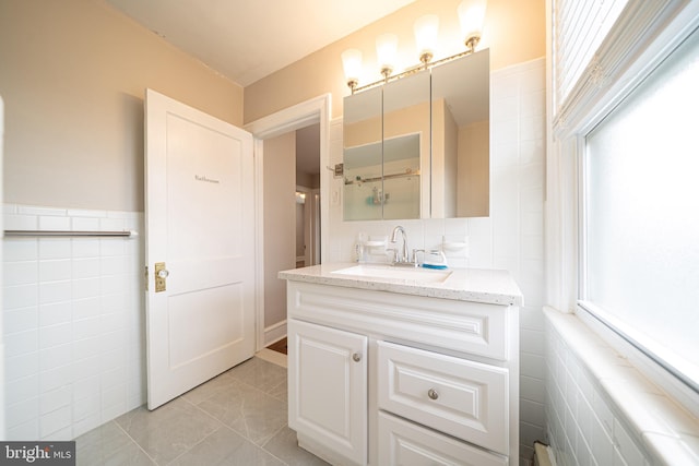 27 Shelbourne Rd, Havertown, PA 19083 - bathroom featuring tile walls, vanity, and tile patterned floors