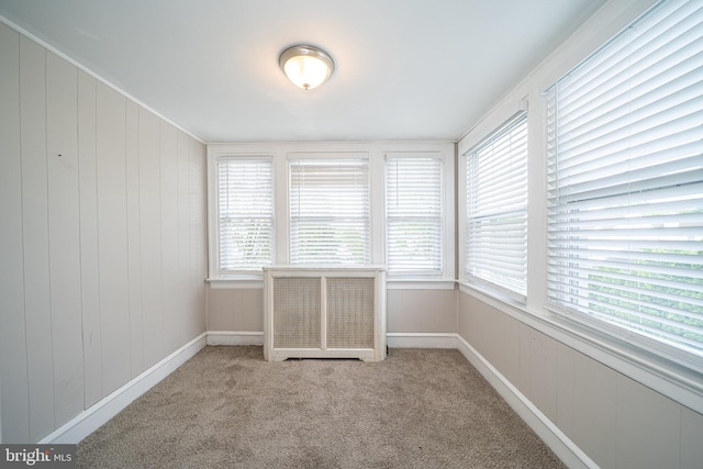 27 Shelbourne Rd, Havertown, PA 19083 - unfurnished sunroom featuring carpet flooring, radiator, and baseboards