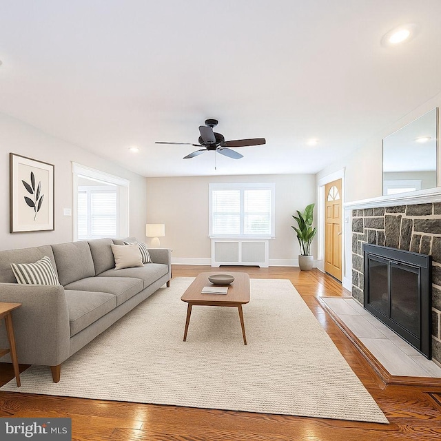 27 Shelbourne Rd, Havertown, PA 19083 - living room featuring a fireplace, baseboards, ceiling fan, light wood-type flooring, and recessed lighting