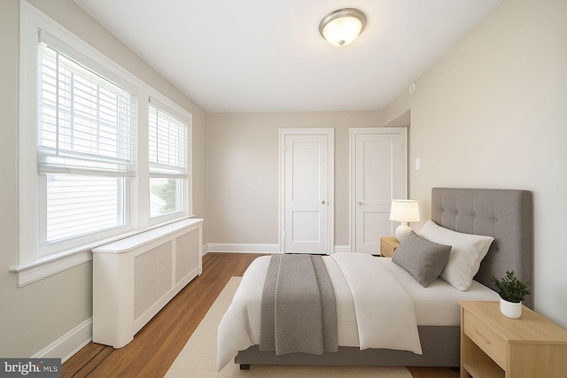 27 Shelbourne Rd, Havertown, PA 19083 - bedroom featuring baseboards, radiator, and wood finished floors