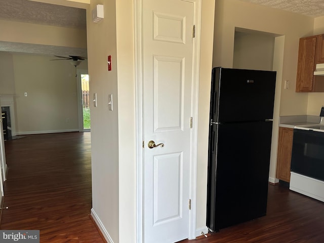 22565 Upper Kells Ln, Great Mills, MD 20634 - kitchen with freestanding refrigerator, electric stove, dark wood-type flooring, and under cabinet range hood
