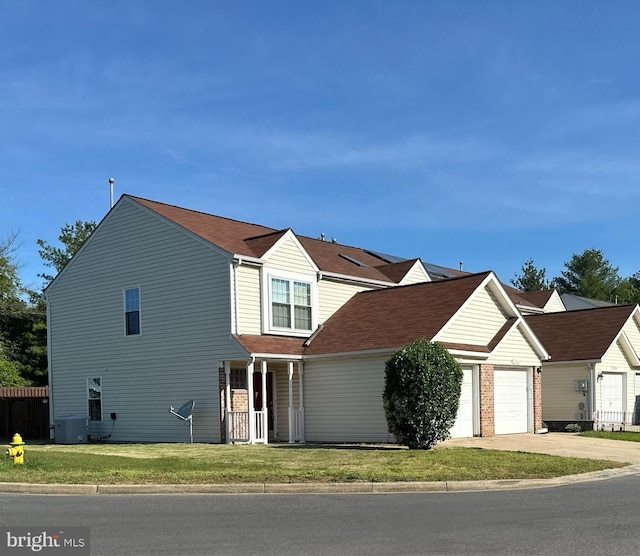 22565 Upper Kells Ln, Great Mills, MD 20634 - traditional-style house featuring a garage, driveway, and central AC unit