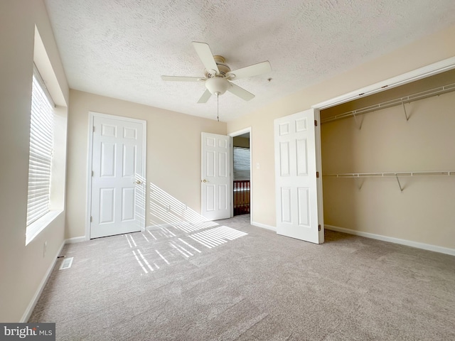 22565 Upper Kells Ln, Great Mills, MD 20634 - unfurnished bedroom with a textured ceiling, a closet, carpet flooring, ceiling fan, and baseboards