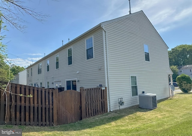 22565 Upper Kells Ln, Great Mills, MD 20634 - rear view of property featuring central AC and a gate
