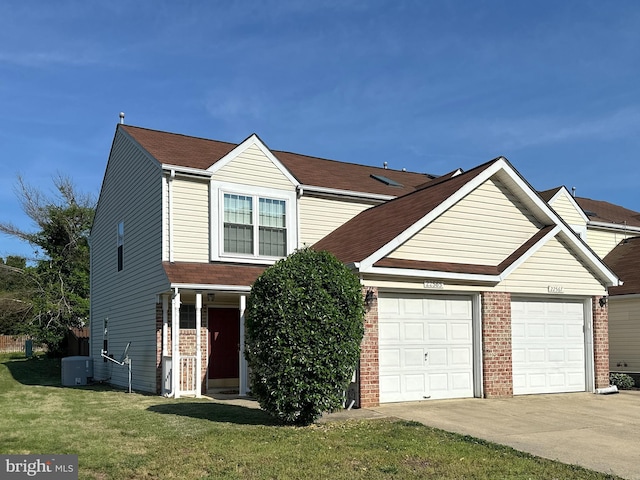 22565 Upper Kells Ln, Great Mills, MD 20634 - traditional-style home with concrete driveway, a front yard, a garage, and brick siding