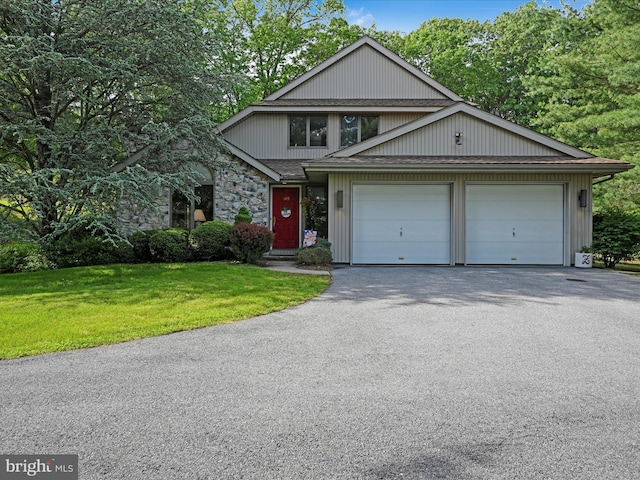 149 Kiehner Rd, Schuylkill Haven, PA 17972 - view of front of property featuring a front lawn, driveway, stone siding, and a garage