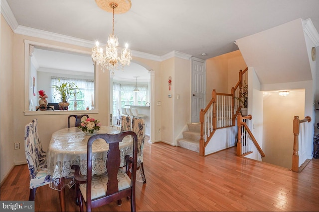 4057 Glostonbury Way, Fairfax, VA 22030 - dining space with a chandelier, hardwood / wood-style flooring, crown molding, stairway, and baseboards