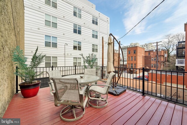 14 E Preston St, Baltimore, MD 21202 - wooden deck with outdoor dining area