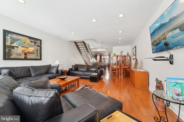 14 E Preston St, Baltimore, MD 21202 - living area featuring light wood-style floors, recessed lighting, stairs, and baseboards