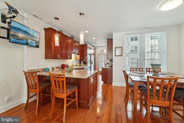 14 E Preston St, Baltimore, MD 21202 - kitchen featuring a sink, light wood-style flooring, baseboards, a peninsula, and recessed lighting
