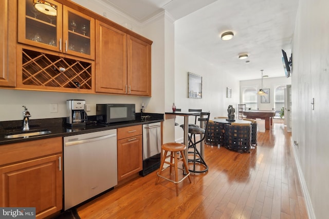 14 E Preston St, Baltimore, MD 21202 - kitchen with dishwasher, black microwave, a sink, brown cabinetry, and crown molding