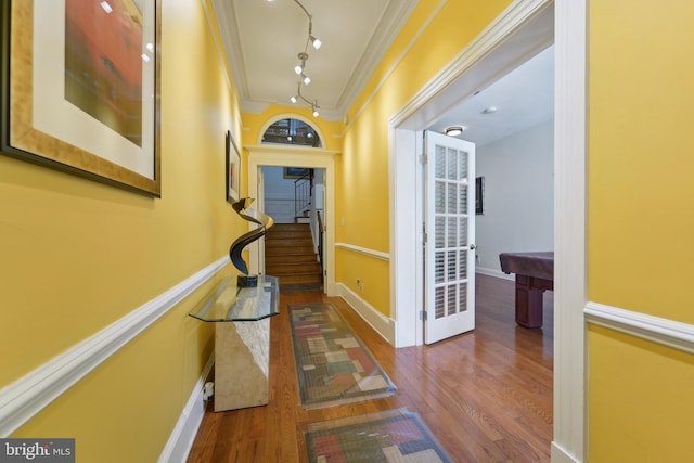 14 E Preston St, Baltimore, MD 21202 - corridor featuring wood finished floors, crown molding, stairs, baseboards, and track lighting