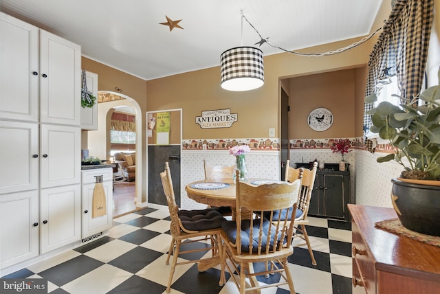 4203 William Penn Hwy, Easton, PA 18045 - dining area with light flooring, healthy amount of natural light, a wainscoted wall, and arched walkways