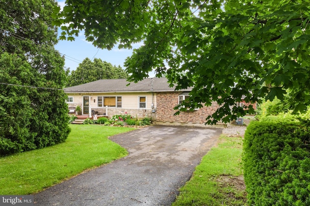 4203 William Penn Hwy, Easton, PA 18045 - ranch-style home with a front lawn, stone siding, driveway, and a wooden deck