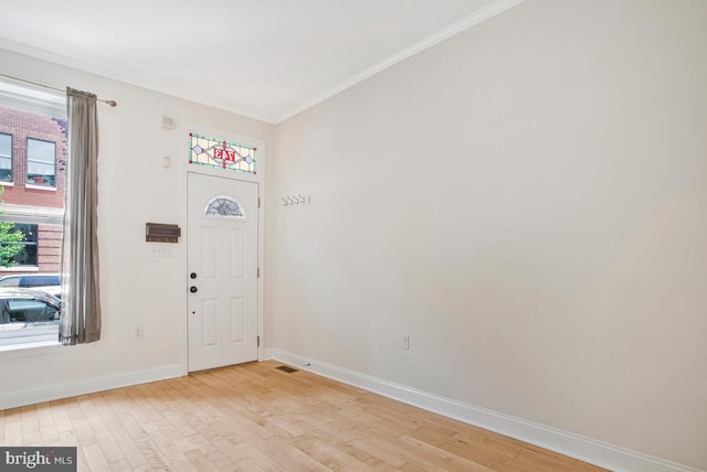743 W Cross St, Baltimore, MD 21230 - entrance foyer with ornamental molding and light wood finished floors