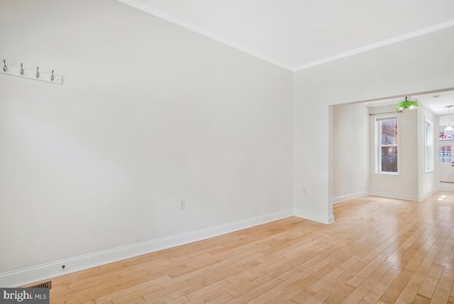743 W Cross St, Baltimore, MD 21230 - unfurnished room featuring crown molding and light wood-style floors