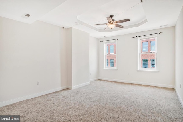 743 W Cross St, Baltimore, MD 21230 - carpeted spare room with a tray ceiling and ceiling fan