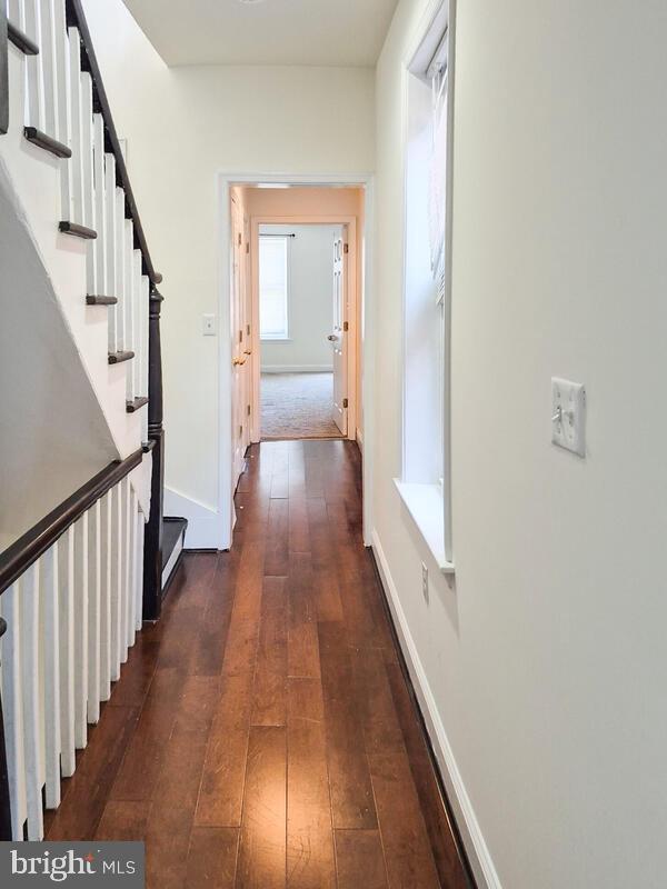 743 W Cross St, Baltimore, MD 21230 - corridor with dark wood-style flooring and stairs