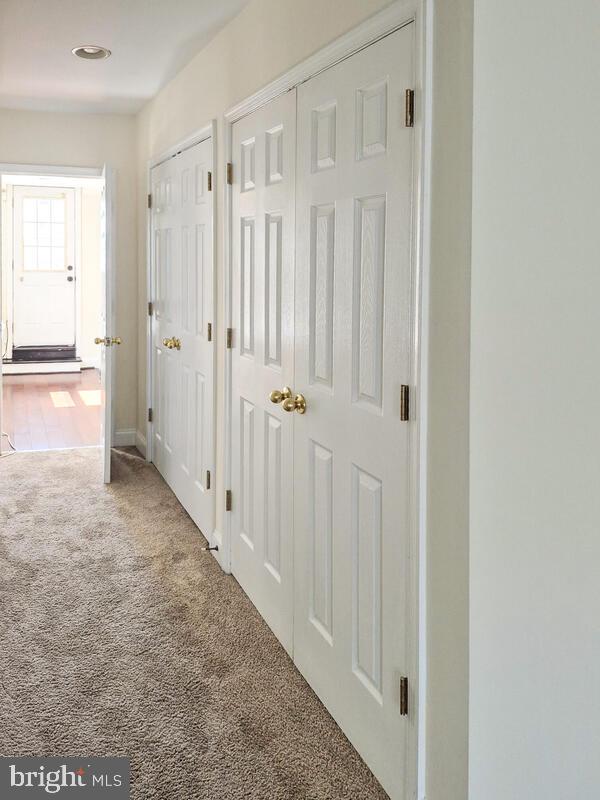 743 W Cross St, Baltimore, MD 21230 - corridor with carpet flooring and baseboards